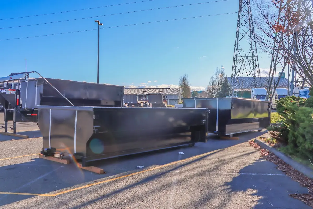 Roll-off dumpster ready for waste disposal at job site for Roofing Dumpster Rental in Durham